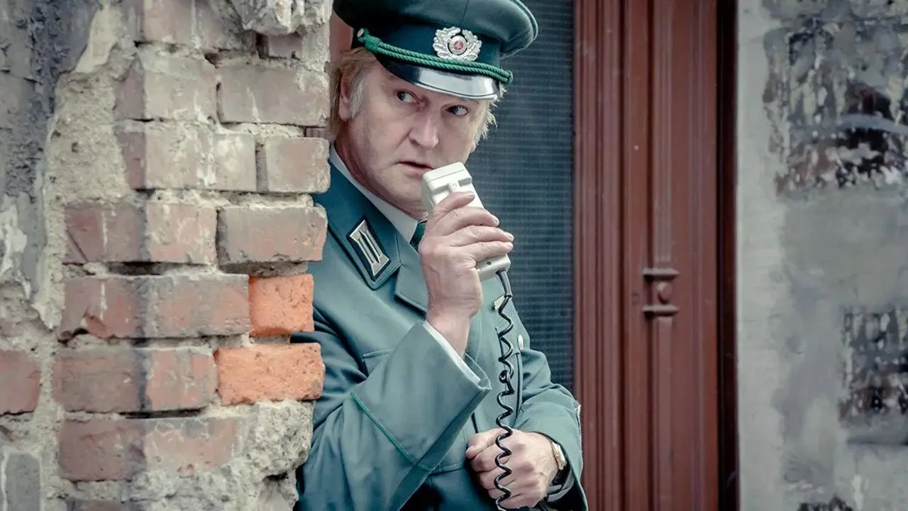 A Stasi Comedy backdrop